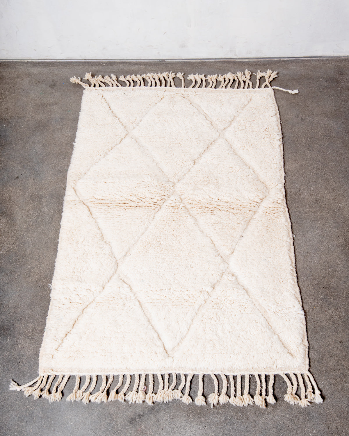 Modern, designer, handcrafted Berber rug from Morocco. Beniourain carpet with minimalist design, natural wool pile and a fluffy texture.